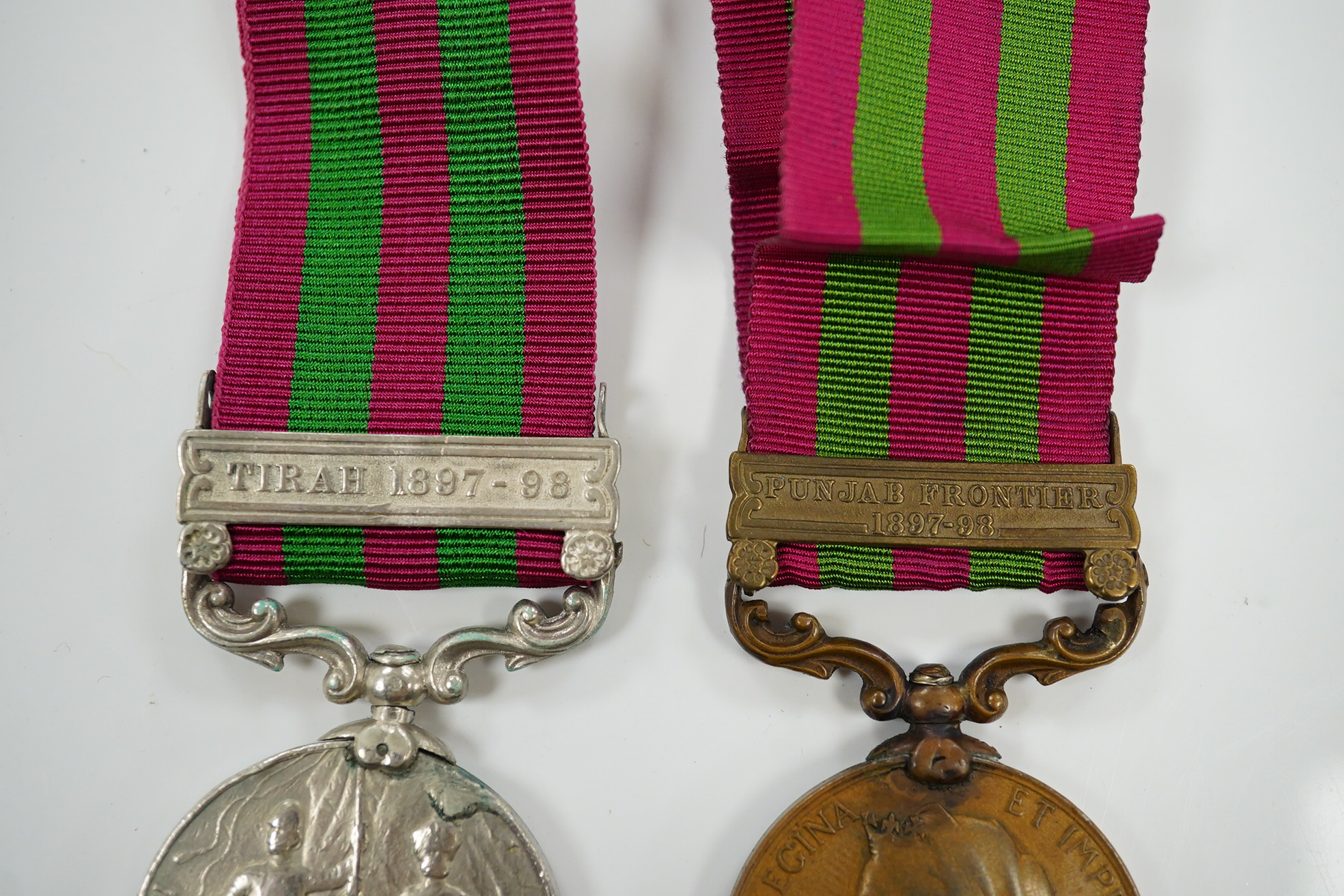 Two India Medals; one with Tirah 1897-98 clasp, naming worn/erased, the other in bronze with Punjab Frontier 1897-98 clasp to ...Transport Dept